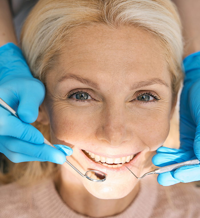 Close up of female patient during dental cleaning
